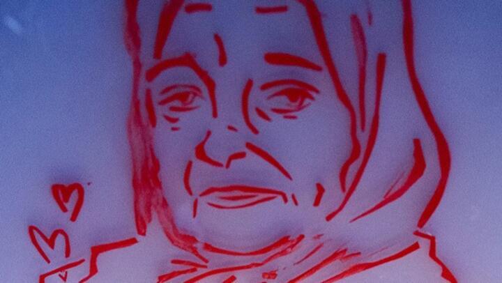 A portrait of 80-year-old Zineb Redouane, painted on a window in Marseille, during a tribute to the Algerian national who died after she was hit by a tear gas canister.